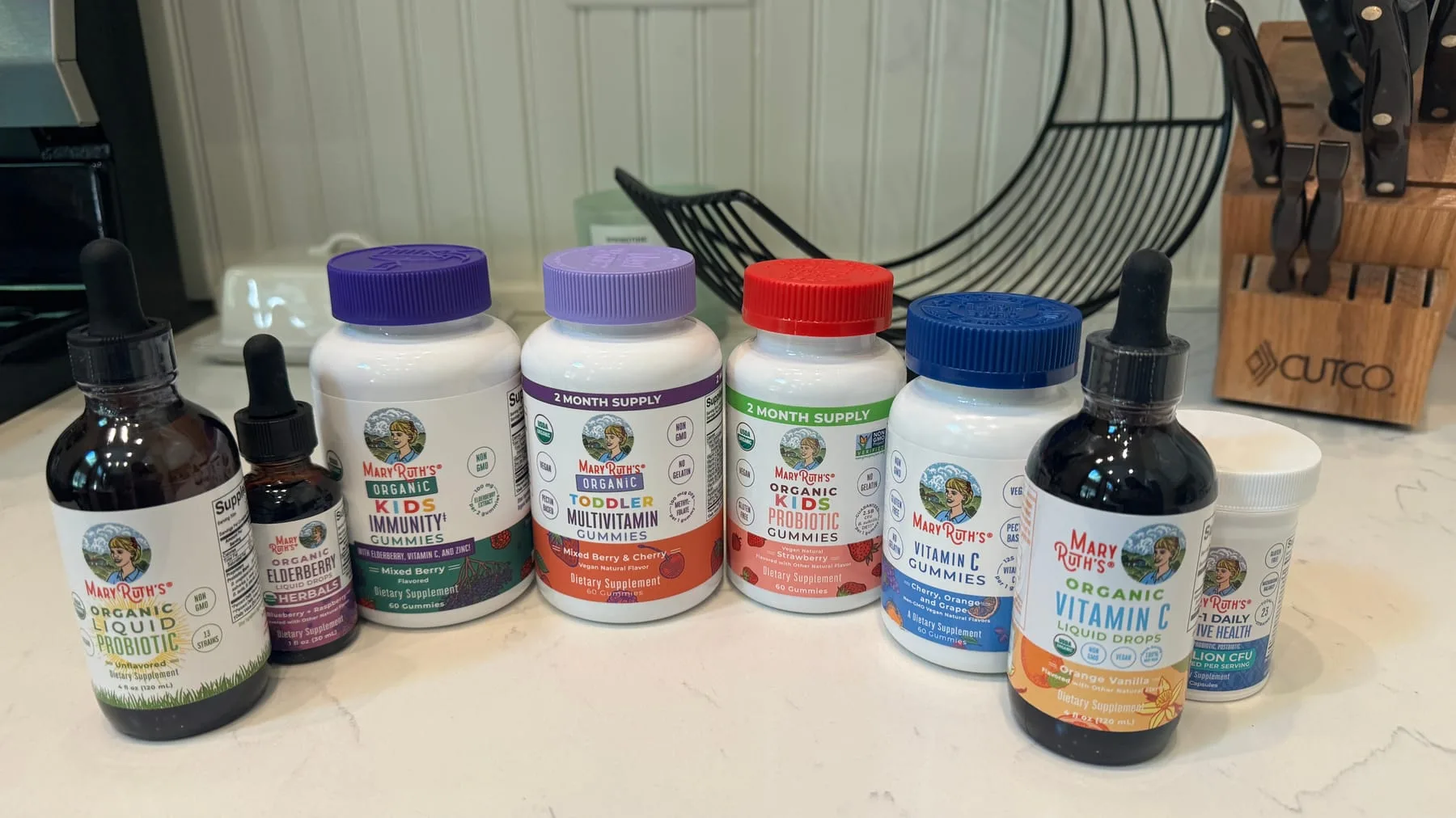The vitamins and supplements we travel with, lined up on the kitchen counter