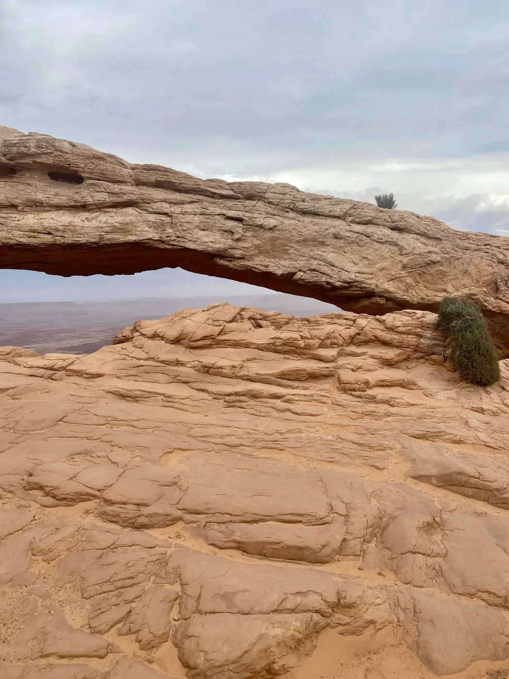 Mesa Arch framing the canyon beyond it