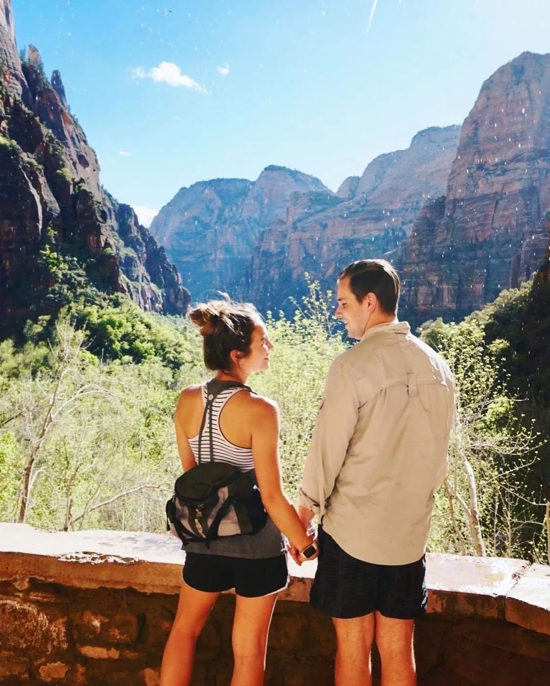 Kiersten and Ryan holding hands at a Zion canyon overlook